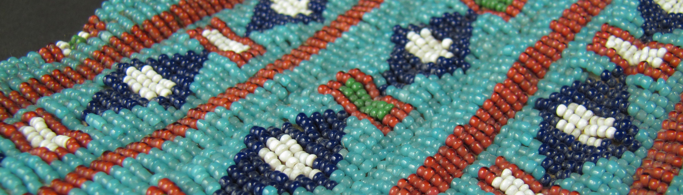 An intricate pattern of blue and red beading